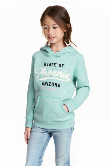 Hooded top with a motif